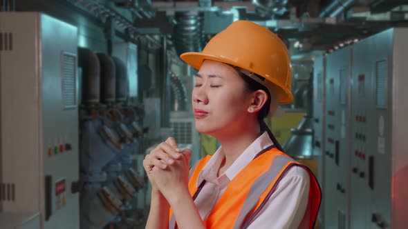 Close Up Side View Of Asian Female Engineer Pray For Something In ...