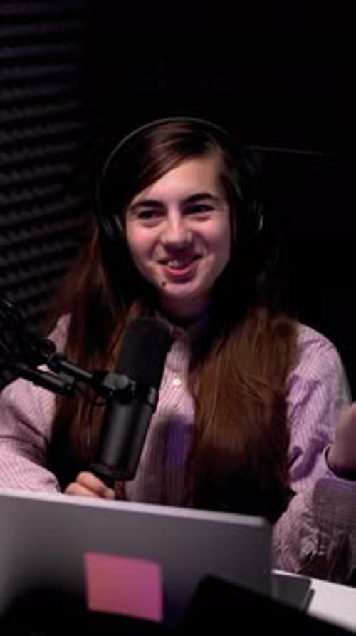 Enthusiastic Woman Recording Podcast in Modern Studio