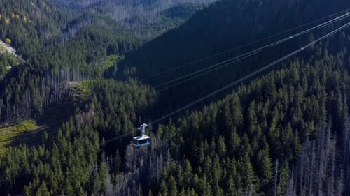 Lift cabins in a mountain ski resort. The movement of ski lifts.