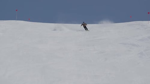Skier Skiing Down Snowy Mountainside