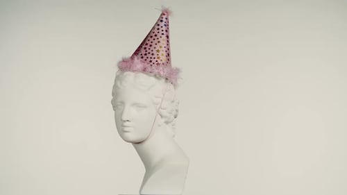 Closeup Shot Ancient Marble Bust Statue of Roman Era Woman in Party Cone Hat Spinning Round on a