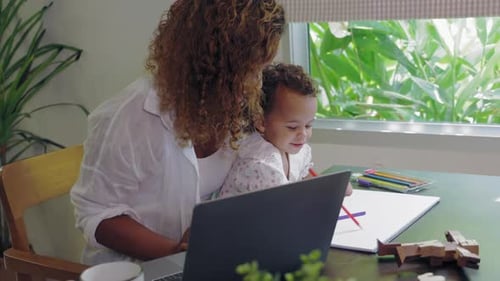 Mother and Child Drawing Indoors at Home