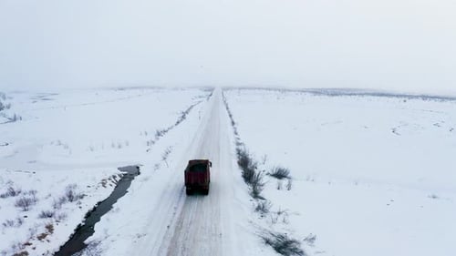 Aerial view of a truck on a snowy road, Russia.