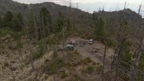 Campers And Off-road Vehicles At Campsite In Nevado de Colima National Park, Colima, Mexico. - aeria