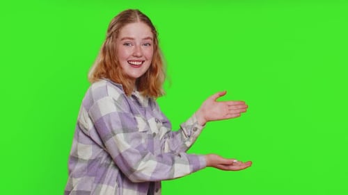 Young Woman Showing Thumbs Up and Pointing at Right on Blank Space Place for your Advertisement Logo