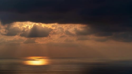 Time lapse of dramatic sunset over the sea.