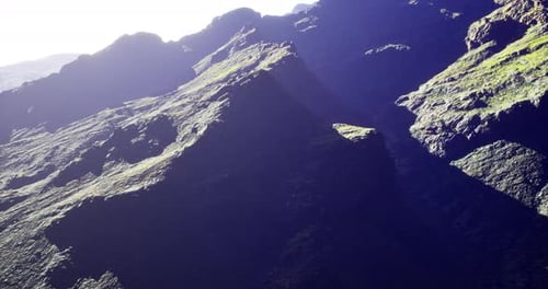 Majestic Mountain Landscape Under Bright Sunlight in the Early Morning