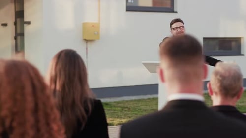 Man Tossing Money in the Air from Podium