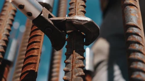Worker Tightening Rebar Coupler with Wrench During Reinforcement Assembly
