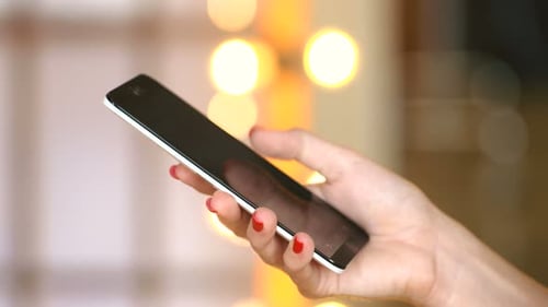 Woman Hand Using Mobile Phone Indoor Close Up