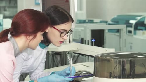 Scientists Working Collaboratively in a Modern Laboratory