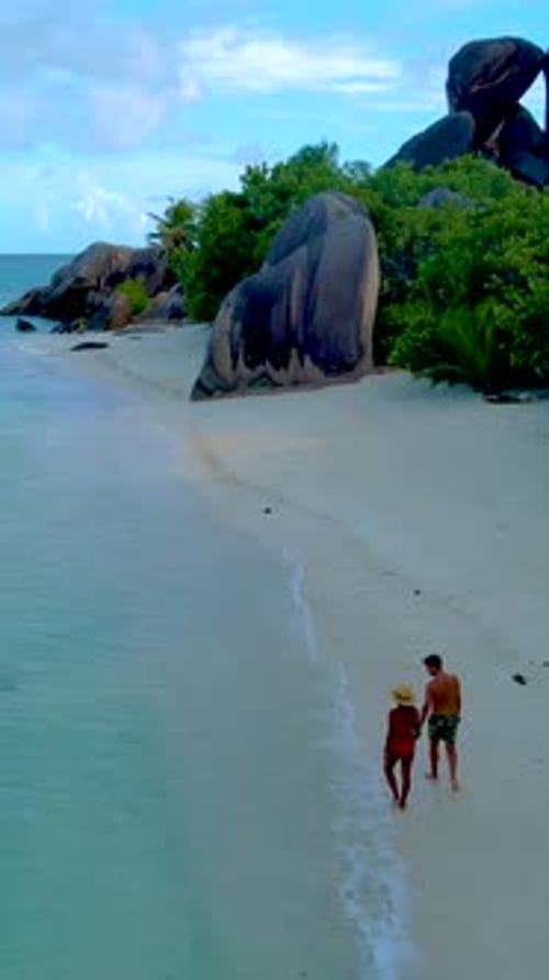Couple on the Beach of Anse Source D'Argent the Most Beautiful Beach of Seychelles