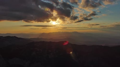 Sunset Over Mountain with Dramatic Clouds