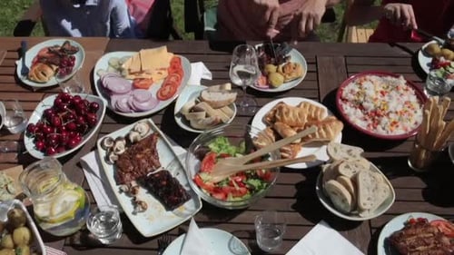 Happy Family Having Festive Dinner or Summer Garden Party Adult