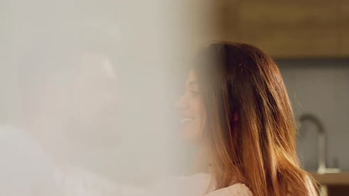 Young Adult Couple Sharing a Loving Kiss