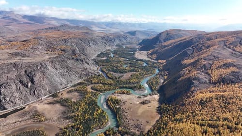 Meandering river in a scenic autumn mountain valley