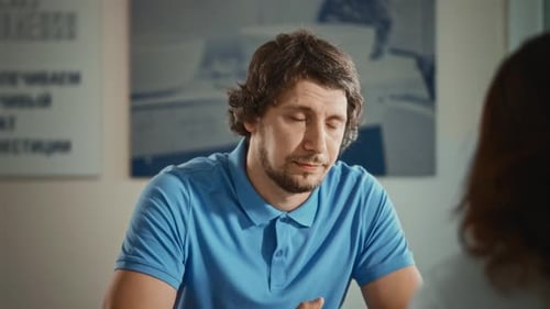 Charismatic Man Talking to a Female Colleague in the Office Work Matters are Discussed During