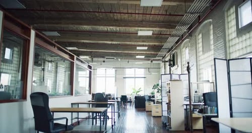 Modern hipster office with large windows and wood floors shot on red camera