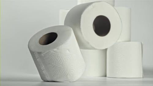 White Toilet Paper Rolls Falling in Slow Motion