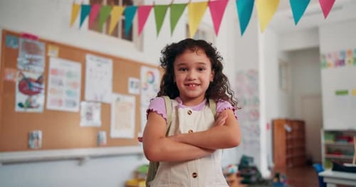 Happy Girl with Backpack in a Classroom