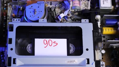 Vintage Old Vhs Cassette 90s is Inserted Into the Player