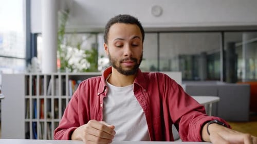 Stressed Young Adult at Desk