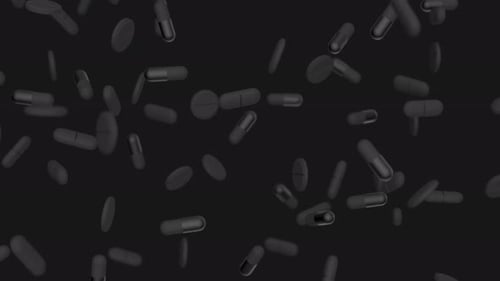 Schwarze Kapseln, Tabletten und Pillen fallen langsam vor schwarzen Hintergrund, Medikamente, Pillen, Tabletten, Medizin