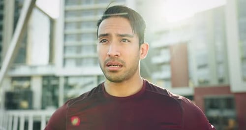 Breathing, fitness and man running in city for race, competition or marathon training