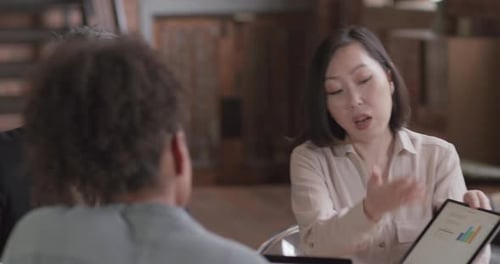 Business Team Meeting with Data Presentation