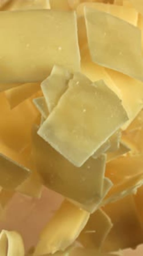 Super Slow Motion Parmesan Cheese on a Light Background Filmed on a Highspeed Camera at 1000 Fps