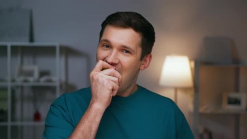 Portrait of Adult Man Eating Healthy Food of Green Apple and Looking at Camera