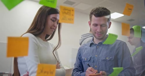 Coworkers Discussing Business Ideas in Office