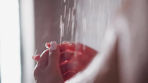 Water Rinsing Hands in Shower