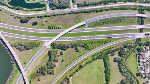 Aerial View of Freeway Overpass Junction with Fast Moving Traffic Cars and Trucks in American Rural
