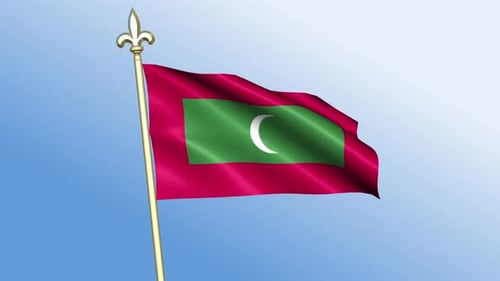 Waving Flag of Maldives Against a Clear Blue Sky