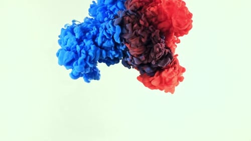 Blue and Red Ink Drops Mixing in Water