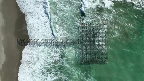 Old Dismantled Pier Aerial View in Slow Motion Strong Storm on the Coast Big Waves in Slow Motion