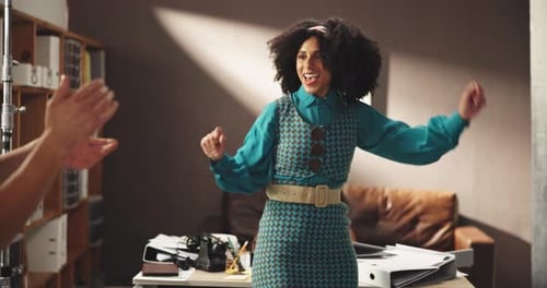 Energetic Woman Dancing and Celebrating in Workplace