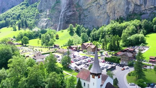 Lauterbrunnen Church with waterfall in the background