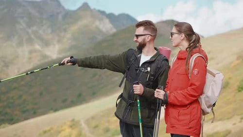 Two Happy Traveller Admiring Landscape From Top of Mount Joyful Man and Woman Hiking in Mountains