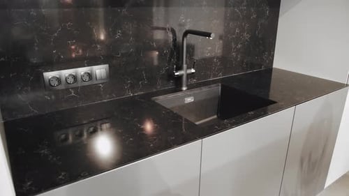Modern Kitchen Sink and Black Marble Countertop