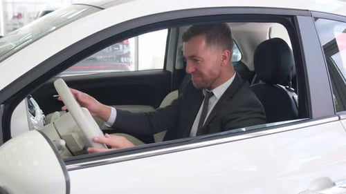 Man in Suit Checks Out New Car