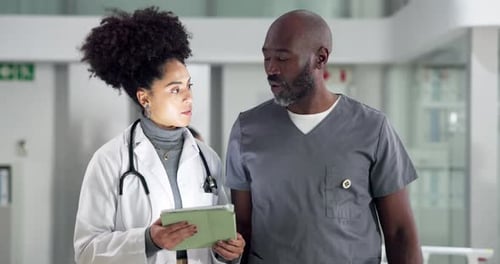 Tablet, discussion and doctor with nurse in hospital for healthcare research