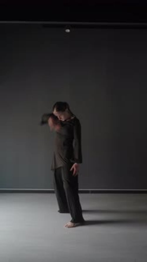 Young Woman Performing a Contemporary Dance in a Minimalist Studio