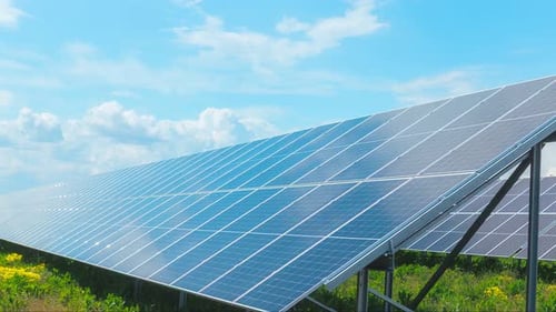 Time Lapse of Solar Panels Absorbing Sunlight on a Clear Day in an Open Field