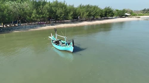 Captivating Coastal Scenery a Traditional Fishing Boat on Calm Water