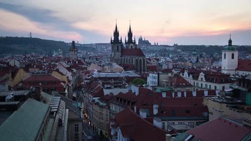 Day to night sunset timelapse of the Prašná Brána (Powder Tower), Old Town Hall, Prague Castle and t