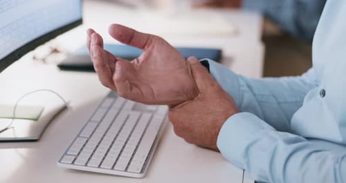 Hand, senior man with arthritis and pain from computer, desk, and massage wrist