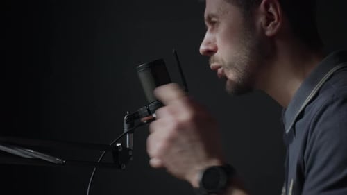 Man Recording Voiceover, Speaking into Microphone