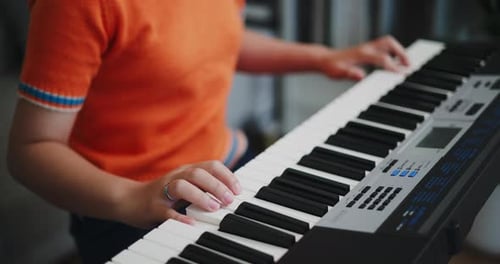 Close Up of Person Playing Digital Piano